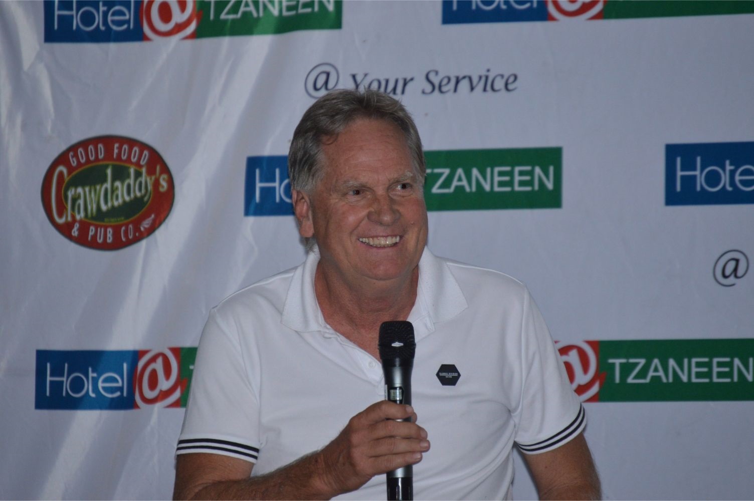 Henning-Gericke-holding-a-mic-speaking-at-a-tzaneen-chamber-of-commerce-event-at-hotel@tzaneen-in-tzaneen